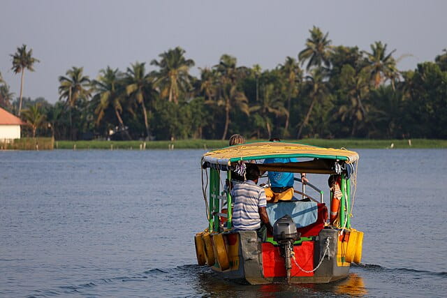 Tourists travelling in a boat in Alappuzha backwaters

