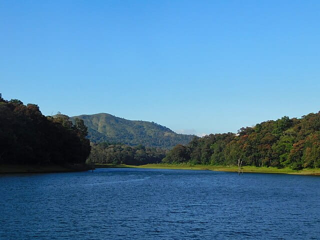A landscape comprising of lake Periyar and mountains at Thekkady.

